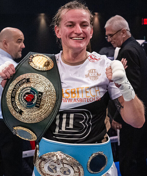 Femke Hermans with her IBF and IBO world title belts